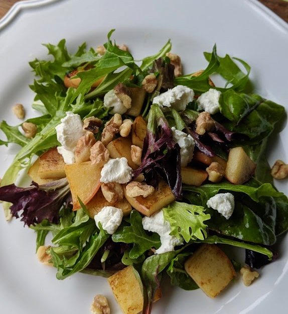 Warm buttered apple salad with fromage blanc and toasted walnuts.