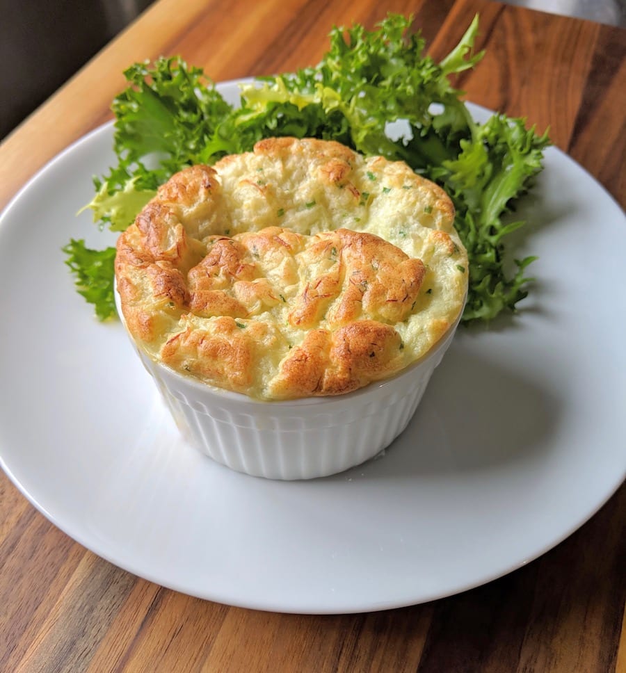 Light and creamy Dungeness Crab soufflé with winter lettuce.