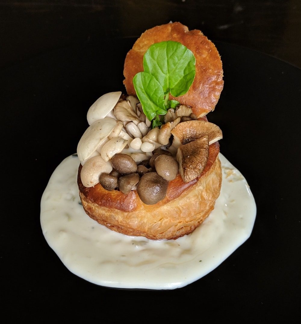 Mixed roasted mushrooms in a puff pastry crust with Gruyère cheese sauce.