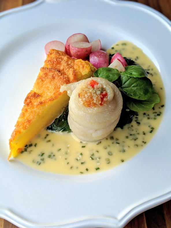 Dungeness crab Stuffed Sole Roulade with Lemon-Chive Beurre Blanc, Spring Egg Potato Soufflé, Wilted Garlic Scented Spinach or Wild Nettles and Seared Radish