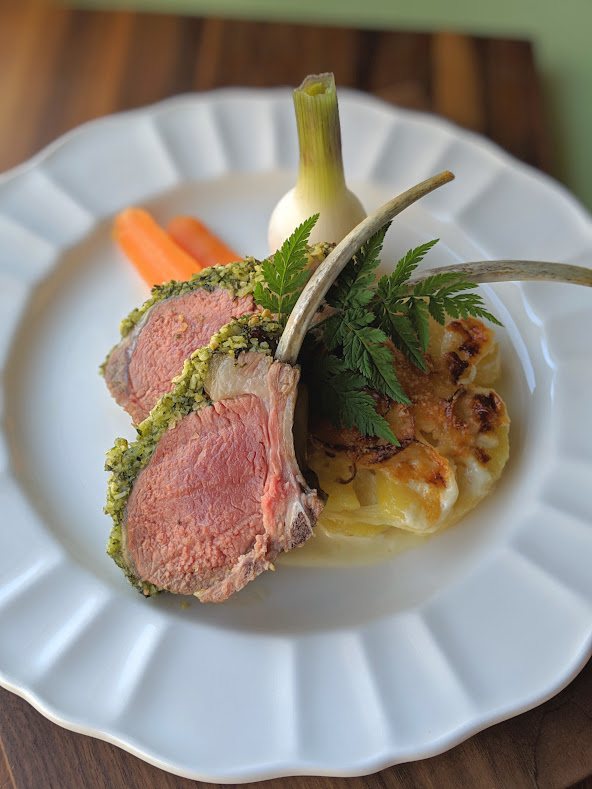 Lamb Racks with Spanish Almond and Mint Crust, Served with Potato-Leek Gratin, Spring Onion and Baby Carrots from the Garden