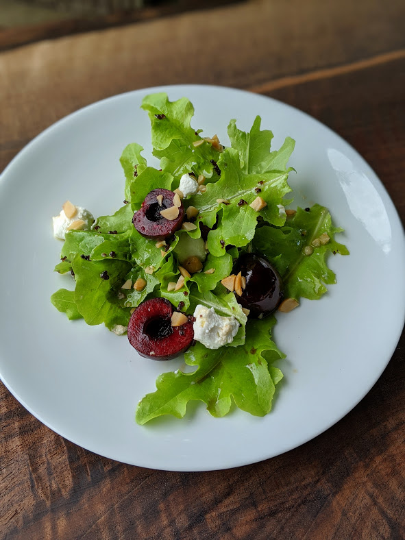 Garden Fresh Oak Leaf Lettuce, Fresh Cherries, Macadamia Nuts, Cypress Grove Fromage Blanc and Toasted Mustard Seed Vinaigrette